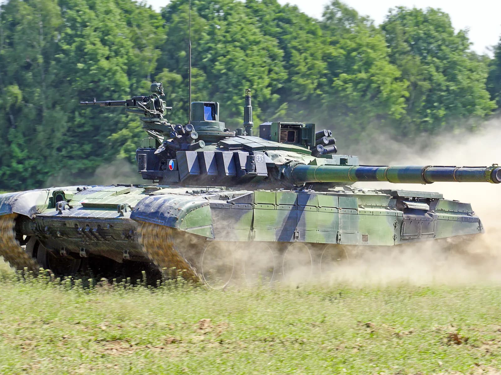 Main battle tank driving across a field